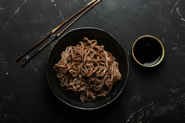 bowl-with-plain-soba-noodles-dark-black-stone-background-from-noodles-cooking-chinese-thai-japanese-dish-with-soy-sauce_1500x